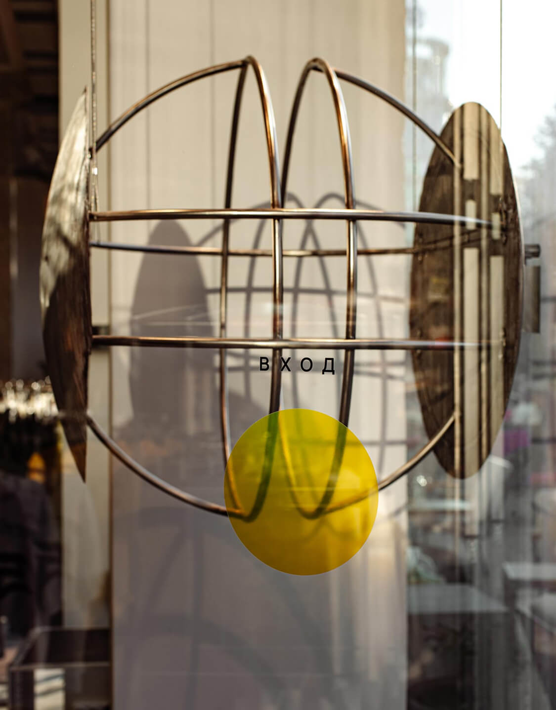 Jikon branded paper shopping bag with handles on a surface